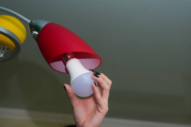 istock An LED light bulb in a woman's hand. 2163606883