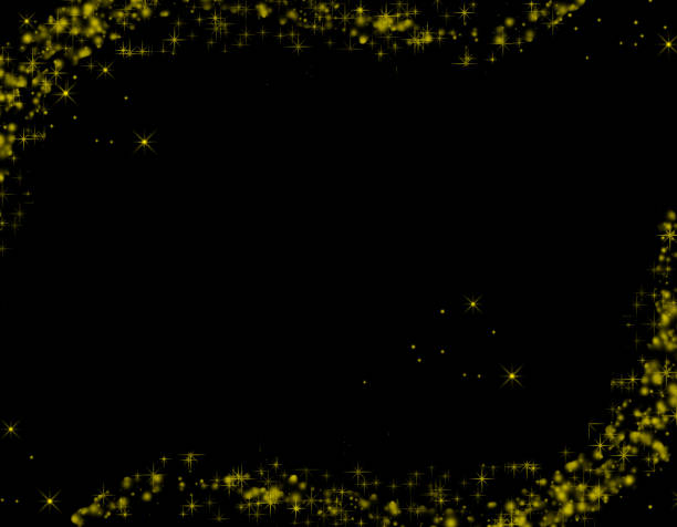 Golden flakes-glittering gold particles are scattered on the black surface.