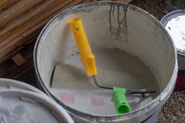 istock Two sponge paint rollers are immersed in water after the work has been done with water-based paints. Concept of tool reuse, maintenance, repair 2163618978