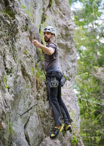 istock Male Climber Ascending Steep Rock Face 2163621732