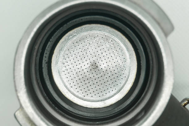 istock The filter is inserted into the holder, top view. Holder with coffee machine filter 2163626032