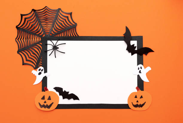 istock Halloween greeting blank card frame for text with black spider web, paper black bats, pumpkins and ghosts on an orange background. Flat layout with copy space 2163627609