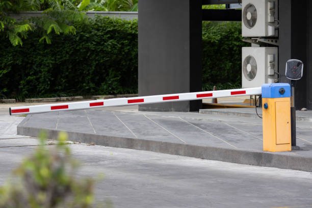 istock A red and white automatic traffic barrier with a yellow top 2163629939