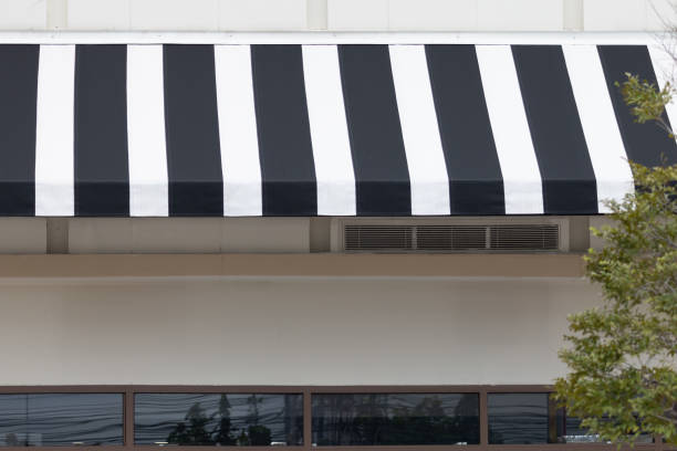 istock A black and white striped awning over a building 2163630081