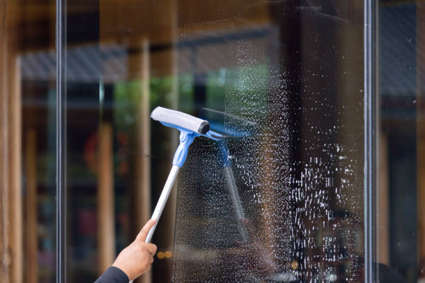 istock A person is cleaning a window with a squeegee 2163630272