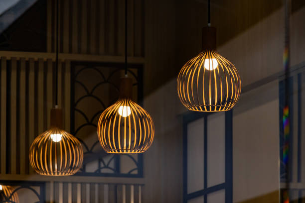 istock Three lamps with a wooden frame are lit up 2163630318