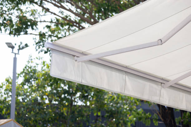 istock A white canopy is hanging over a tree. a white shop awning. 2163630447