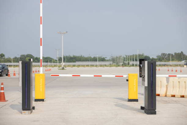 istock A parking lot with two yellow and red automatic barriers. 2163630451