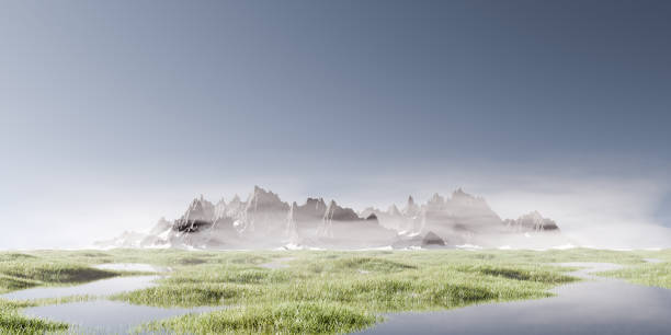 istock Mountain Range in the Mist with Grassy Field and Water Reflection 2163630592