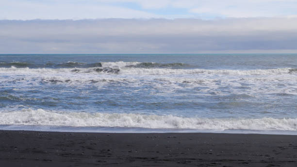 istock sea and sky. waves on the beach 2163633147