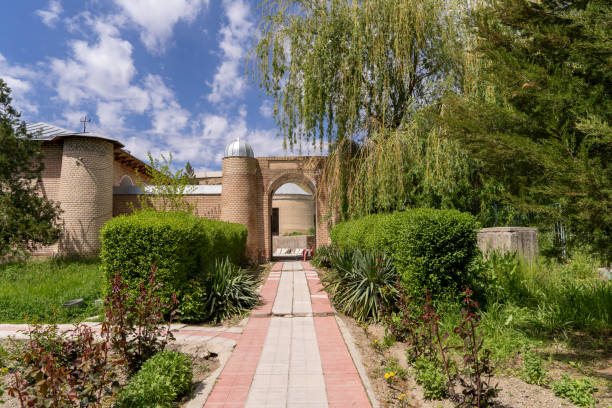 istock A brick walkway leads to a building with a large archway 2163633174