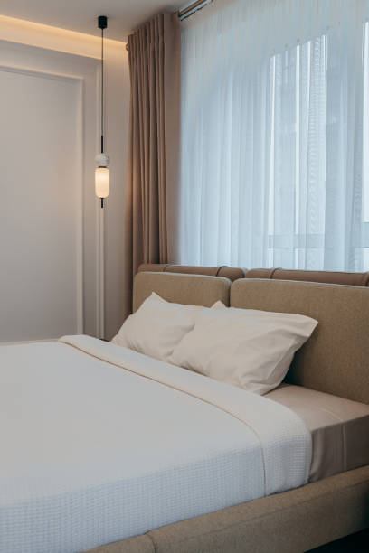 istock Bedroom with a bed, bedside table and lamps 2163634688