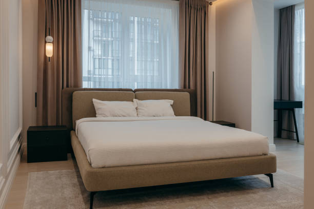 istock Bedroom with a bed, bedside table and lamps 2163634742