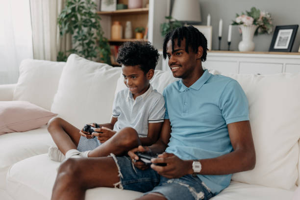 istock Father-son bond over shared video game enjoyment 2163635563