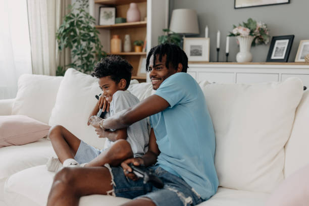 istock Father and son playing video games, bonding moment 2163635600