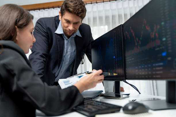 istock Two business traders discussing business statistic on report paper. Postulate. 2163637904