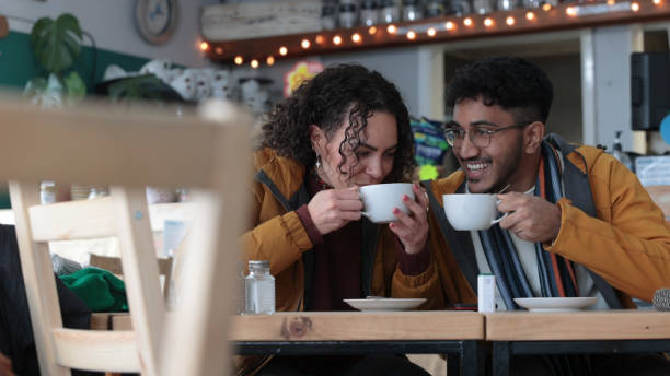 istock Mixed race couple enjoy coffee at a cafe 2163645583