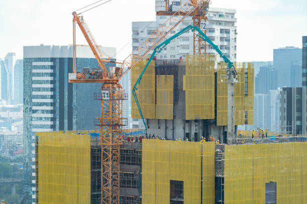 istock Image of exterior skyscrapers construction site with tower cranes. Ornamented. 2163647384
