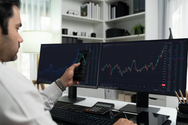 istock Trader businessman searching on smartphone, analyzing in dynamic stock. Surmise. 2163648329