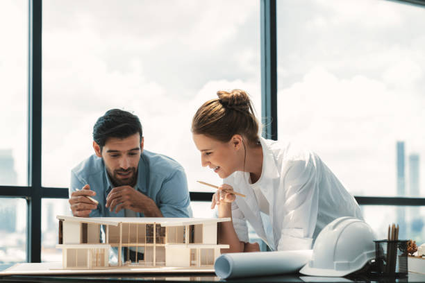 istock Smart architect engineer team working together to measure house model. Tracery. 2163648546