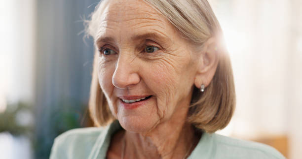 istock Old woman, thinking and peace in home, reflection and remember past life or memory in retirement. Female person, nostalgia and wondering in lounge, imagine future and contemplate choice or decision 2163649664