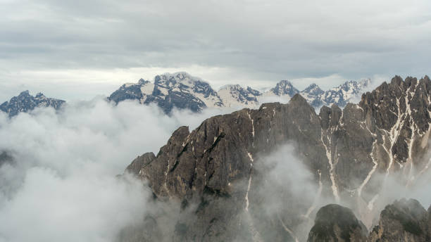 istock Exploring Tre Cime Circuit in June Snow 2163650906