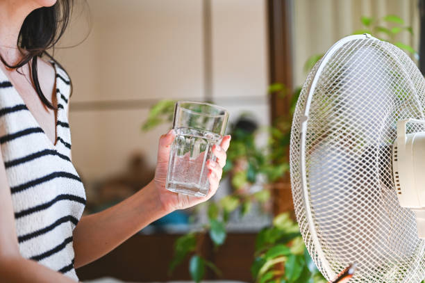 istock Drinking fresh water in front of fan. 2163651062