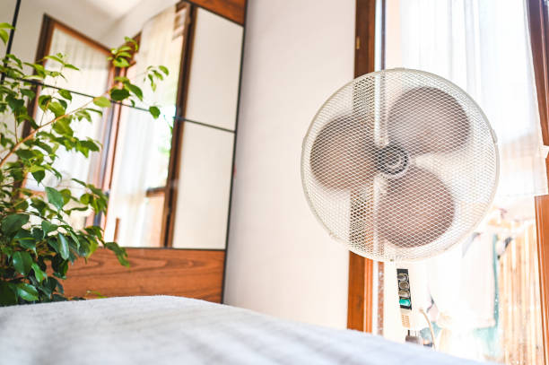 istock fan blowing in a bright room. 2163651231
