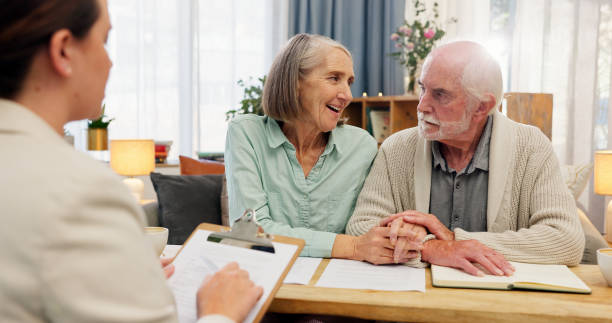 istock Home, old couple and consultant with documents, retirement plan and conversation for mortgage loan. Financial meeting, man or woman in lounge, paperwork for legal agreement or will with budget advice 2163653821