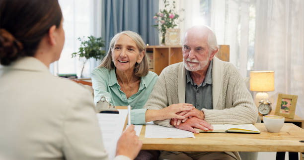 House, old couple and consultant with documents, retirement plan and conversation for budget advice. Financial meeting, man or woman in lounge, paperwork for legal agreement or will with investment