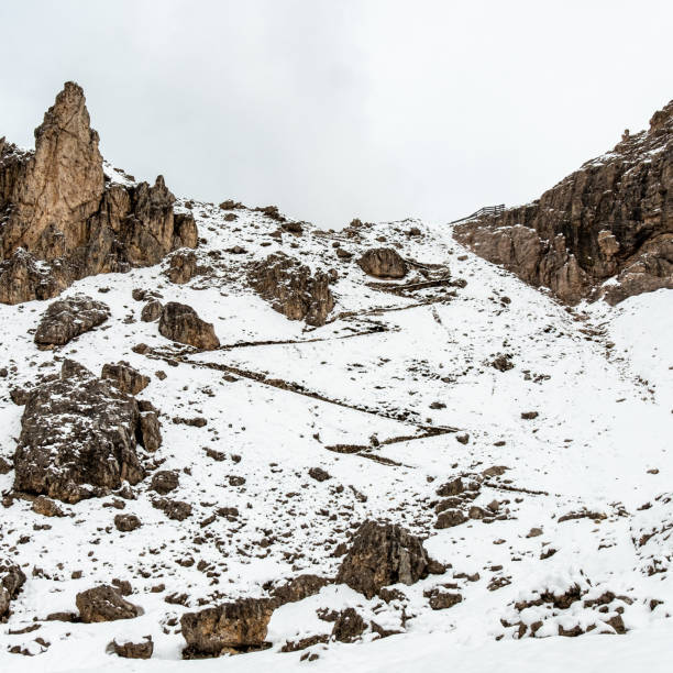 istock Exploring the Cir Group: Snowy June Hikes Through Misty Dolomite Landscapes 2163654193
