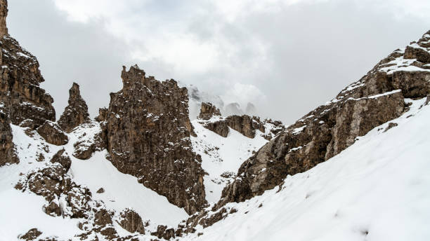 istock June's Enchantment: Trekking Through Snow and Clouds in the Cir Group, Dolomites 2163654203