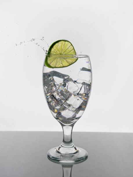 Dropping a lime into water.