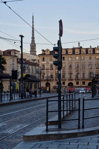 Vehicles On The Cobbled Streets Of Turin At Dusk, Italy