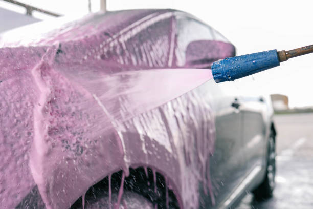 istock Hand washing car with pink foam, advertising 2163659876