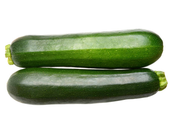 istock Two green zucchini isolated on white 2163659927