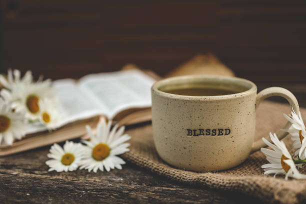 istock Cup with the inscription blessed and open Bible, Christian concept 2163660067