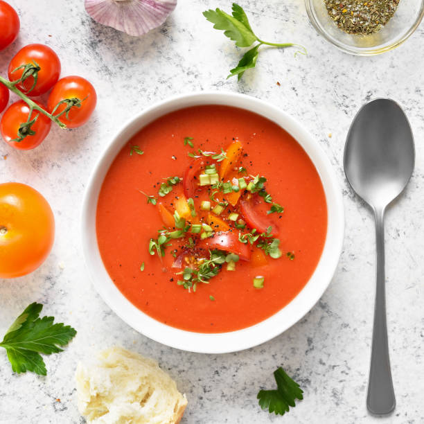 istock Tomato gazpacho soup in bowl over light stone background 2163660592