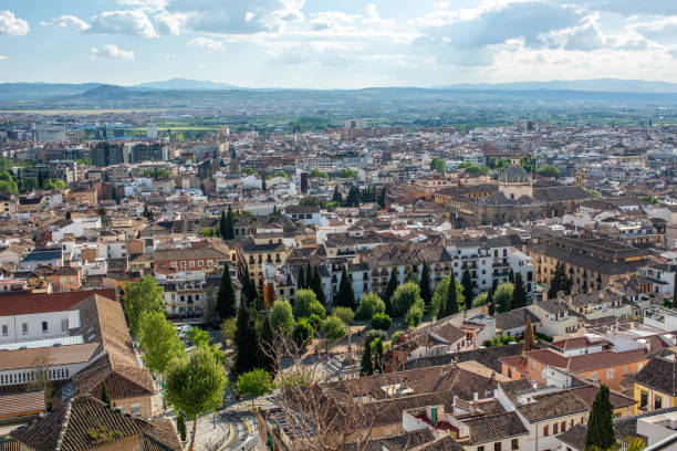 A stunning panoramic view of Granada, Andalusia, Spain, showcasing its beautiful architecture and landscape from the Alhambra hilltop.