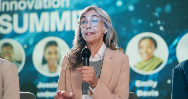 istock Stage, woman and speaker at convention as event host, panel discussion or guest with microphone. Summit, public speaking and person with speech at conference for innovation in climate change workshop 2163665263