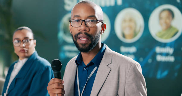 istock Presentation, black man or speaking at seminar for speech, climate change or sustainability. Male researcher, representative or talking at event for environment care, lecture or conference intro 2163665268