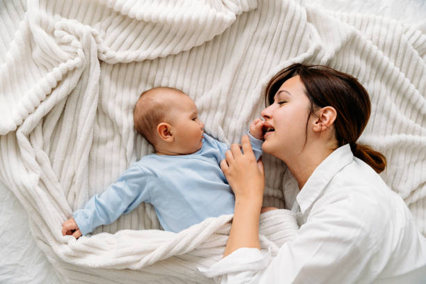 istock Mother morning cuddle with her baby 2163668053