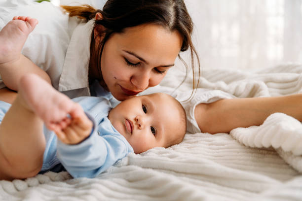 istock Mother morning cuddle with her baby 2163668186