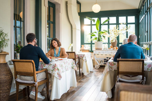 istock Diverse Guests Enjoying Breakfast at Boutique Hotel 2163669422