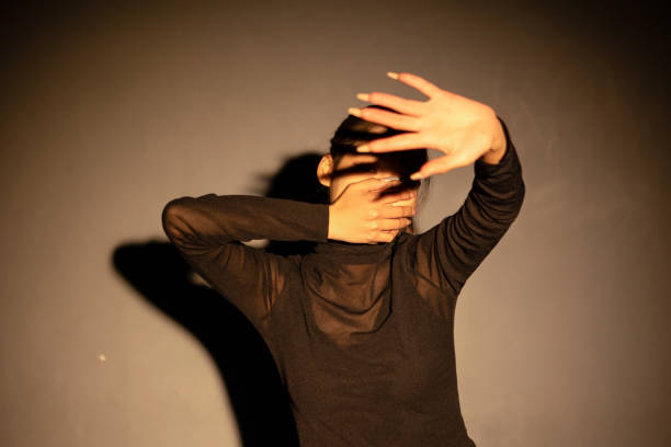 istock A girl covering her mouth 2163670465