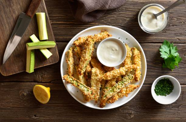 istock Crunchy zucchini breaded sticks with dip sauce 2163671235