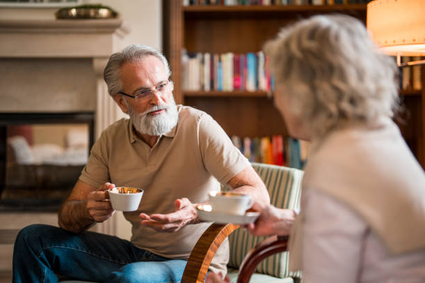 istock Elderly Couple Enjoying Coffee Time in Hotel Lounge 2163671749