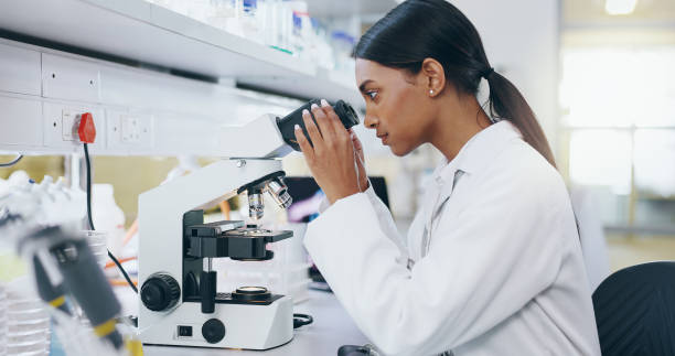 istock Sample, research and woman with microscope, science and check experiment for DNA analysis. Person, scientist and employee with lab equipment, forensic testing and cure development to study bacteria 2163672047