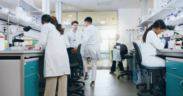 istock Innovation, science and group of people in laboratory for work on breakthrough, cure or development. Experiment, investigation and research with scientist team in clinical trial for medicine 2163672050