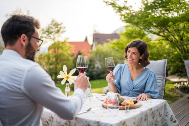 istock Diverse Couple Enjoys Alfresco Dining 2163672459